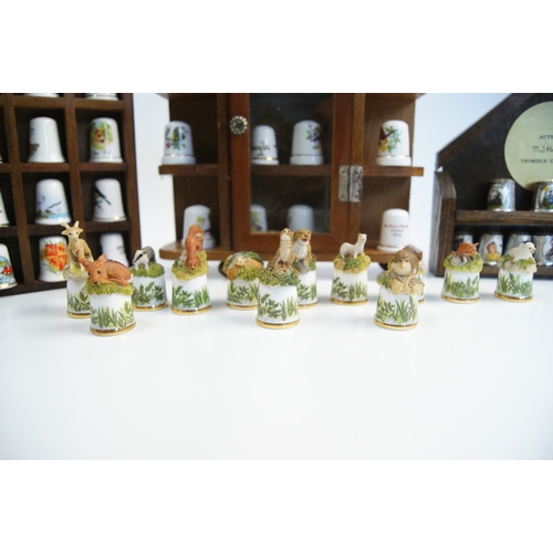 96 - A Large Collection of Hummel and Franklin Mint Decorative Thimbles with Wooden Display StandsAn ex... 