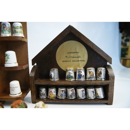 96 - A Large Collection of Hummel and Franklin Mint Decorative Thimbles with Wooden Display StandsAn ex... 