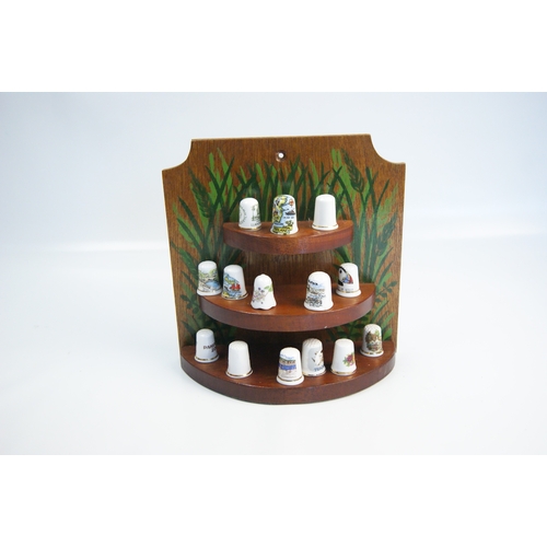 96 - A Large Collection of Hummel and Franklin Mint Decorative Thimbles with Wooden Display StandsAn ex... 