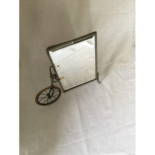 14 - An easel backed mirror,
designed as a bicycle -