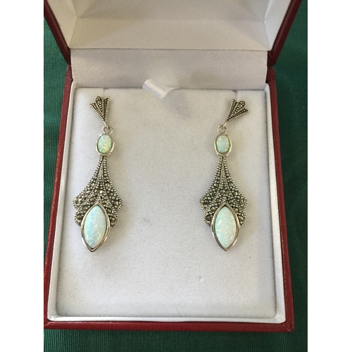 46 - A pair of silver ear-pendants,
in the Art Deco style, each set with marcasite and opalite -