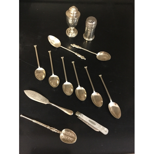 55 - A small mixed lot of silver,
to include six seal end spoons, fruit knife, cruet items, copy anointin... 