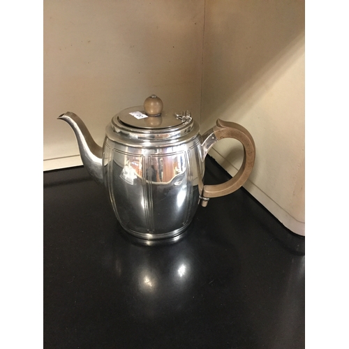 56 - A silver teapot, Goldsmiths & Silversmiths Co. London 1936,
with geometric panels -