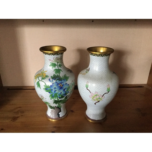 96 - A pair of tall cloisonné vases,
each decorated with flowers, birds and insects on a white ground -