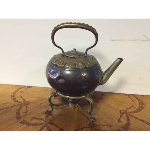 98 - An Arts & Crafts copper and brass kettle on stand,
by Benham & Froud, with brass decoration to colla... 