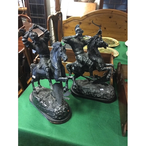 100 - A pair of French painted spelter figures of warriors
on horseback -