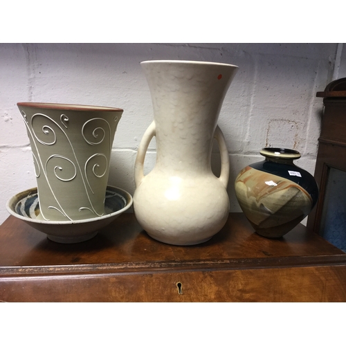 129 - Four pieces of pottery,
to include studio bowl and Denby vase -