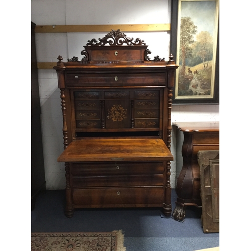 315 - A 19th century Beidermeier secretaire a' abbatant,
with floral and scroll cresting and drawer all ov... 