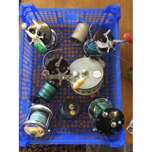 409 - A group of six fishing reels,
including Grice & Young, Penn etc and three spools -