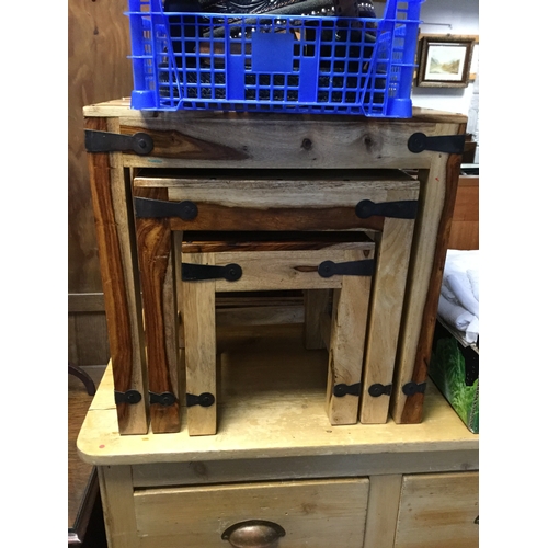 353 - A nest of three sheesham wood tables -