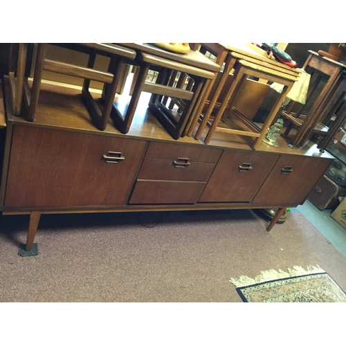 359 - A mid century sideboard,
fitted with an arrangement of drawers and cupboard doors -