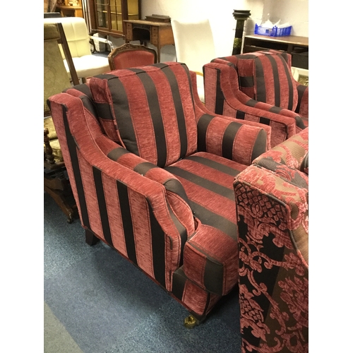 372 - A modern three piece suite,
upholstered in burgundy stripes and floral damask style upholstery, on c... 