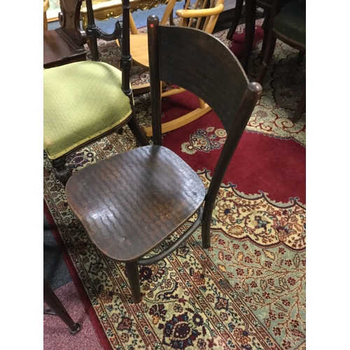 374 - A vintage child's chair,
with pressed scale decoration -