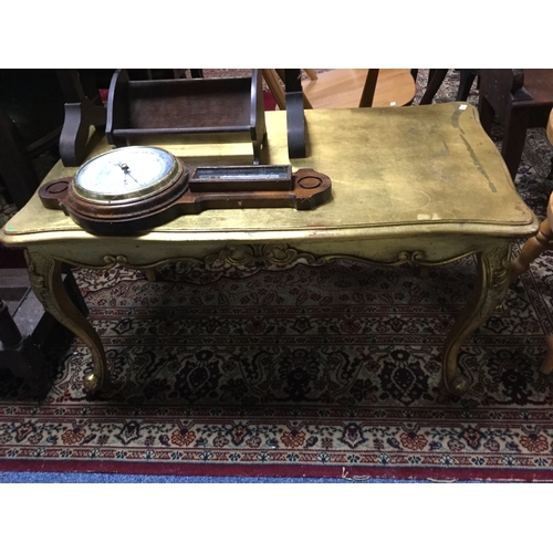 378 - A gold finish coffee/occasional table,
on leaf capped legs -