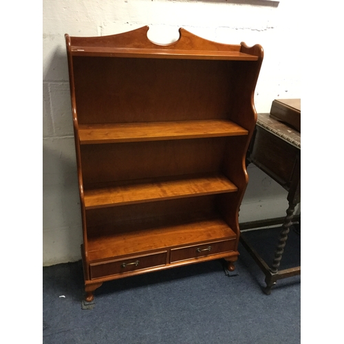 379 - A modern waterfall style open bookcase,
with two base drawers -
