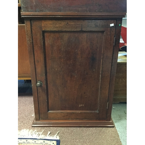 381 - A mahogany wall mounting cupboard,
with single door -