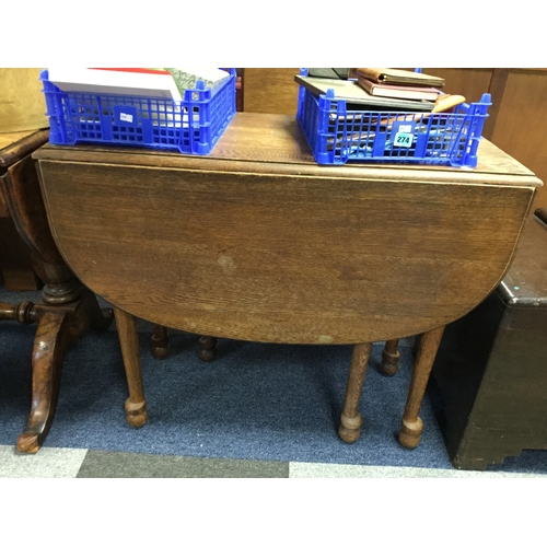 383 - A 19th century oak gateleg table,
on tapering legs -