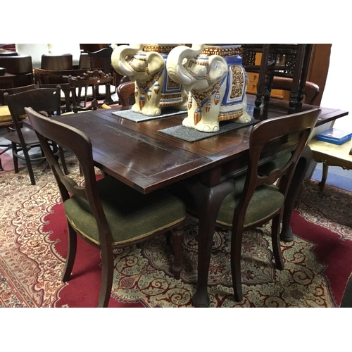 386 - An early 20th century drawer leaf table
and a set of four dining chairs -