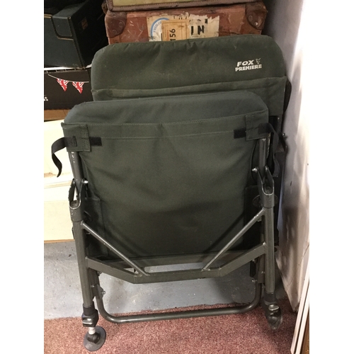 412 - Fishing: A Fox carp seat,
together with another seat, a Shakespeare float rod and a box of fishing f... 