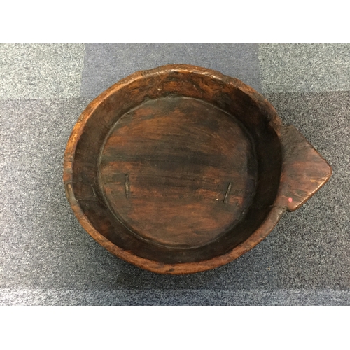 273 - A large wooden dough bowl -