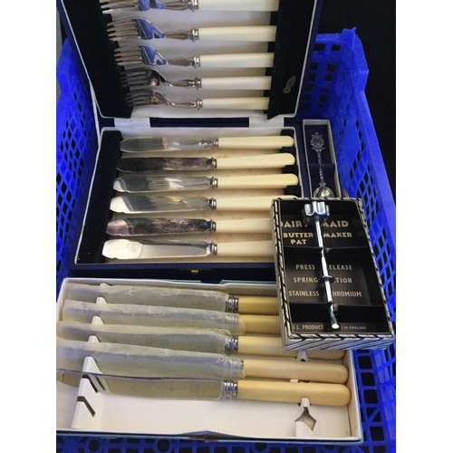 61 - A quantity of silver plate, 
to include cased bean end spoons, tea knives etc -