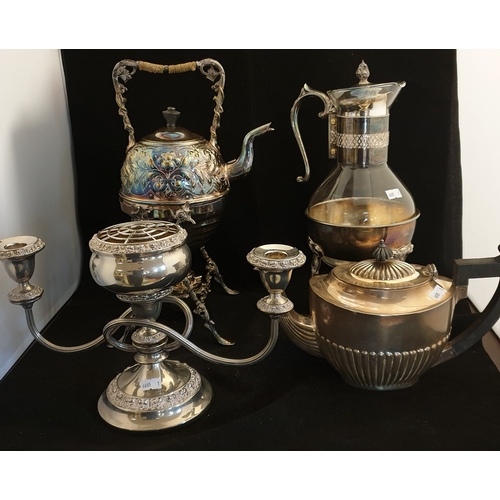 145 - A mixed lot of silver plate, 
to include kettle on stand, another glass coffee pot on stand, candela... 