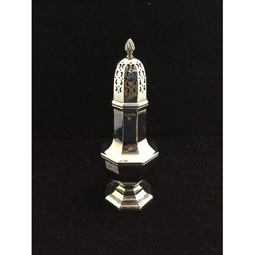 6A - A silver caster, London 1910, 
with pierced cover -