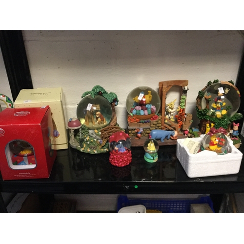 227 - A group of eight snow globes, 
including some musical and of Disney interest -