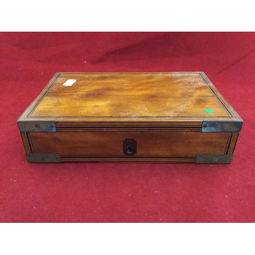 228 - A small inlaid and brass mounted box,
with lined interior -