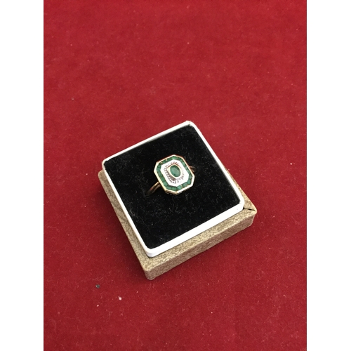 65 - A 9ct gold ring, Art Deco style and set with an emerald and diamond panel -