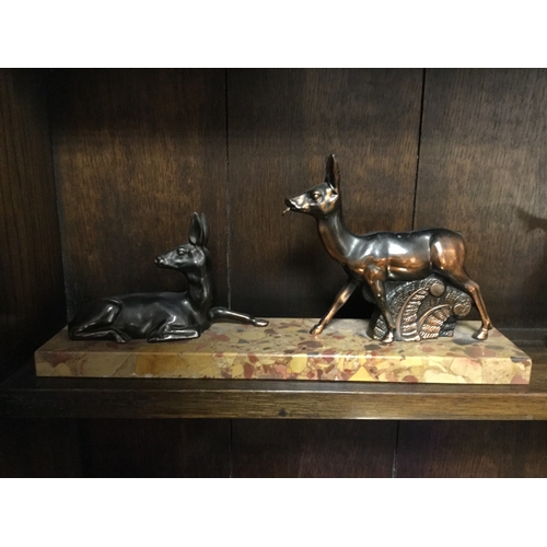 82 - An Art Deco mantel ornament of two deer on a marble base and another (a/f) with bird decoration -