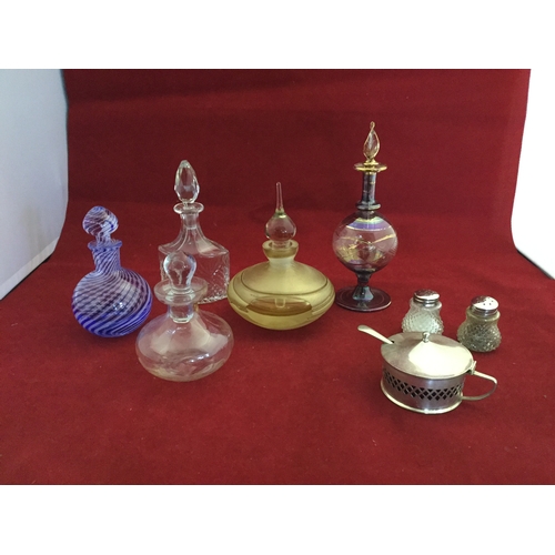 109 - A group of glass scent bottles, cruet etc -