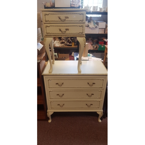 256 - A French style three drawer chest 
and a matching bedside chest fitted with two drawers -