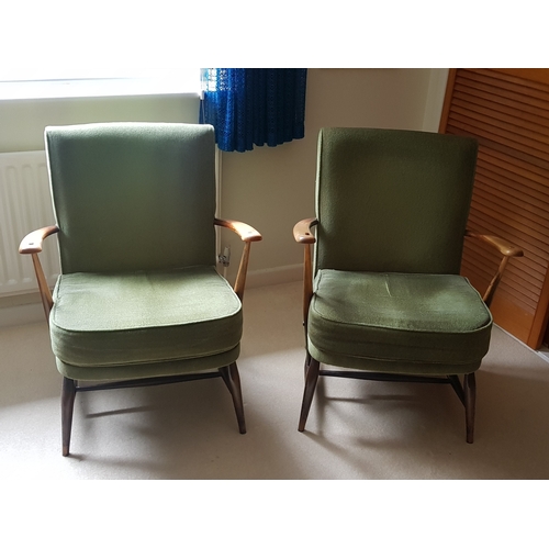 257 - A pair of Ercol armchairs -