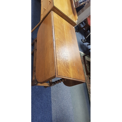 263 - An oak gateleg table, with barleytwist supports -