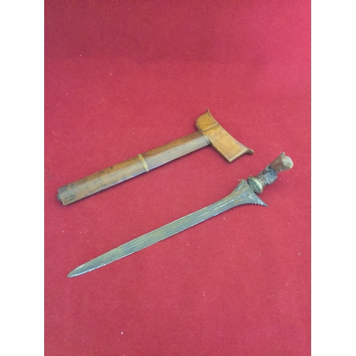 350 - A Balinese Kris dagger, in wooden sheath, with carved handle -