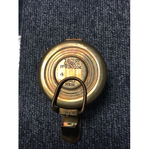 353 - A brass cased compass, with crows foot, 
marked 1943 Mk III -