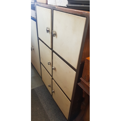 354 - An industrial steel cupboard/locker, 
with three rows of doors -