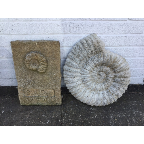 380 - Two ammonite style garden ornaments -