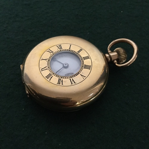 25 - A Waltham half hunter pocket watch, the white enamel dial with Arabic markers and subsidiary dial -