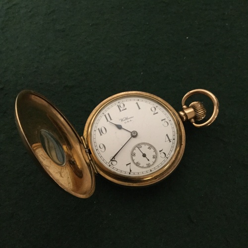 25 - A Waltham half hunter pocket watch, the white enamel dial with Arabic markers and subsidiary dial -