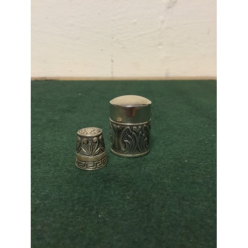 33 - An Art Nouveau style silver thimble and a thimble case, both stamped 925 -