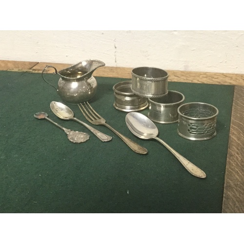 46 - A mixed lot of silver and plate, to include silver jug, silver napkin rings, flatware and assorted p... 