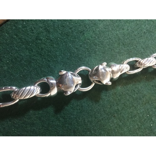 47 - A silver bracelet, with Cartier style panther heads -