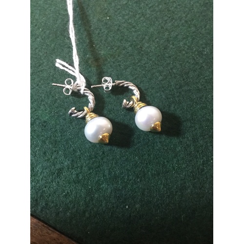 48 - A pair of silver and pearl ear-pendants, with gilded detail -