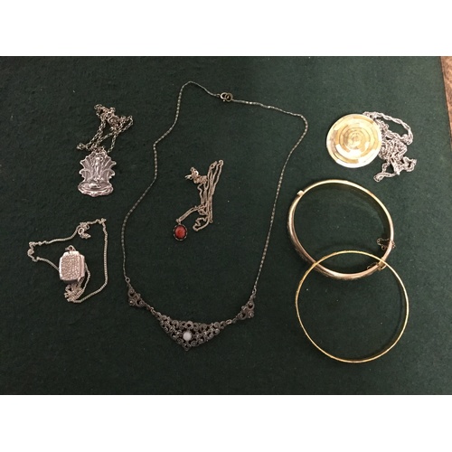 60 - An Art Nouveau silver pendant on chain, a gold plated silver bangle, other silver necklaces etc -