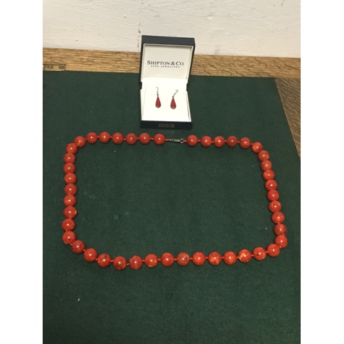 68 - A pair of coral ear-pendants and a coral necklace -