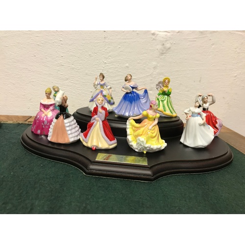 112 - A collection of twenty Royal Doulton miniature ladies with two display stands -