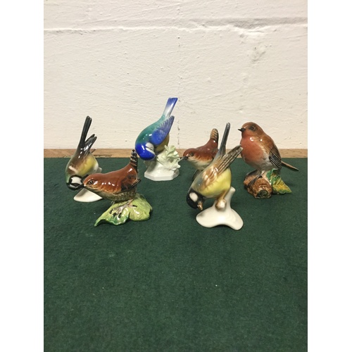 129 - A group of six Beswick and Goebel birds -