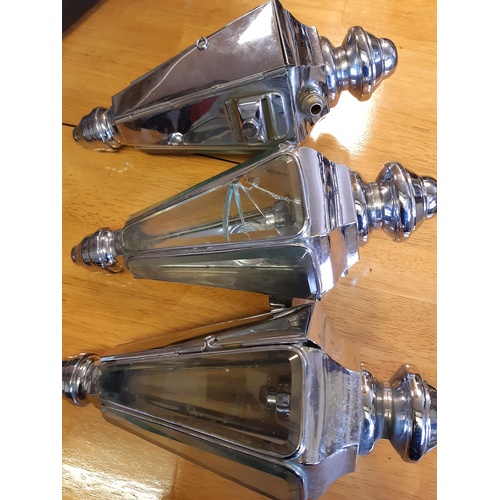 419 - Three chromed lamps, panelled and with bevelled glass -